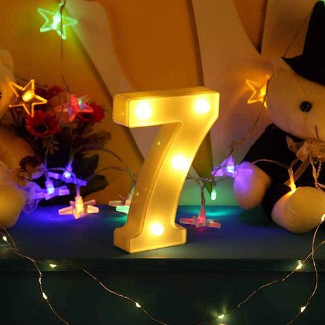 Numero 7 luminoso bianco a LED decoro per eventi feste luce calda 3000k 16x3 cm alimentato da 2 batterie (1/5)