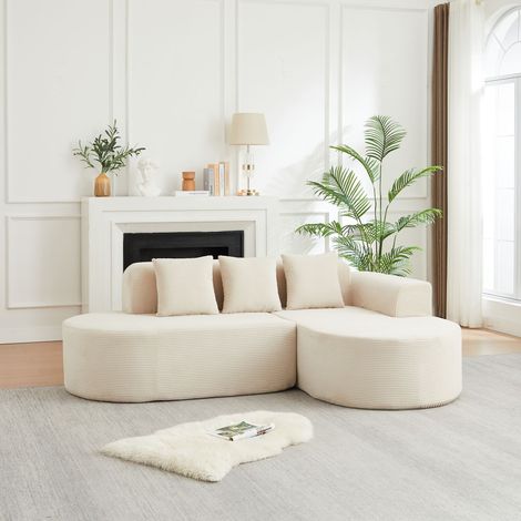 Sofá esquinero modular en forma de L, de 220 cm de largo, en pana con respaldos y reposabrazos curvos, equipado con tres cojines, adecuado para salones. (1/5)