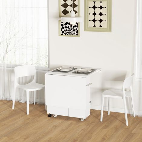 Mesa plegable con alas abatibles, estantes de 3 niveles, caja de almacenamiento y ruedas, de MDF, 130 x 80 x 76,5 cm, color blanco.