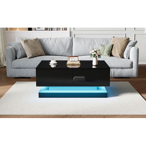 Table de salon en verre noir, mesurant 90×50×38 cm. Tablette convertible avec 2 tiroirs. C’est une table de salon parfaitement adaptée à un intérieur chaleureux, équipée d’un éclairage LED. (1/5)