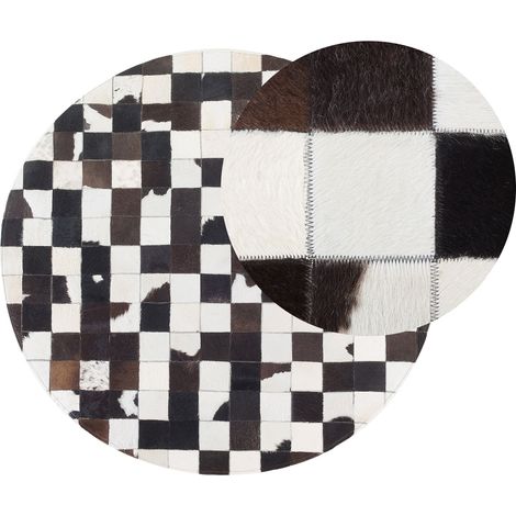 Alfombra redonda de piel negra y blanca ø 140 cm patchwork elaborada a mano Bergama