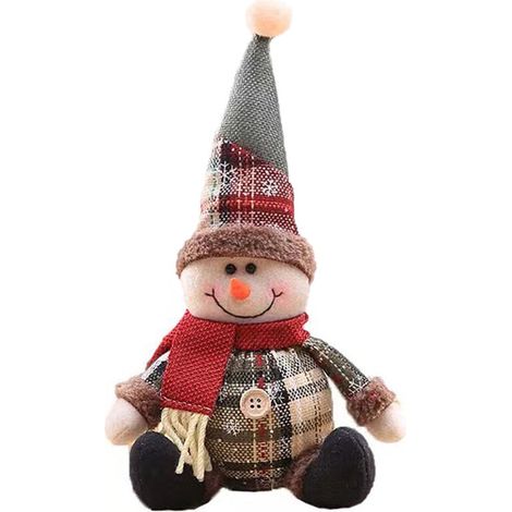 Décorations de Noël, peluches bonhomme de neige et Père Noël, cadeaux pour une fête de Noël avec cheminée.