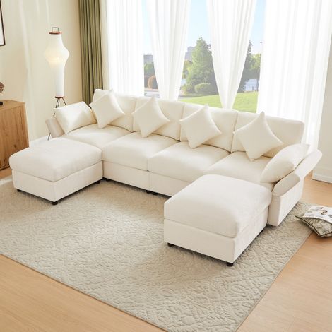 Canapé en chenille de forme U/L avec deux poufs, accoudoirs réglables, quatre coussins décoratifs et deux appuie-têtes. (1/5)