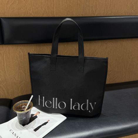 Bolsa de tela no tejida con cremallera, 35 x 40 x 10 cm, reutilizable, apta para el trabajo, las compras, etc., negra, con texto, una unidad. (1/5)