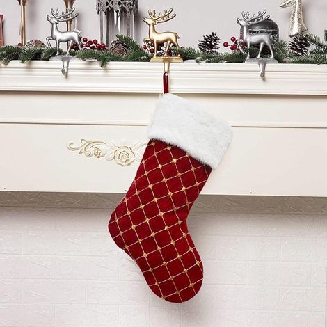 1 calza di Natale grande, rossa, con polsino in pelliccia sintetica, ideale per decorazioni natalizie in famiglia. (1/4)