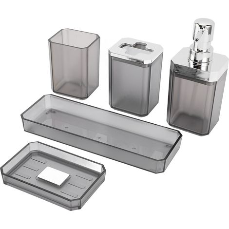 Ensemble d'accessoires de salle de bain comprenant un porte-brosse à dents, un gobelet, des flacons de lotion, un porte-savon et un plateau gris. (1/5)