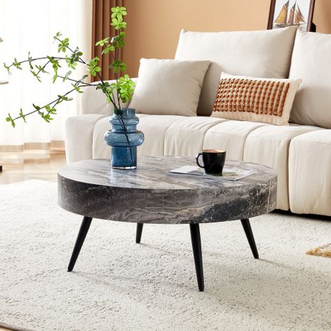 Table basse ronde de 70 cm de diamètre, aspect marbre gris (MDF) et pieds en métal noir. Design minimaliste, idéale pour le salon et les petites pièces.