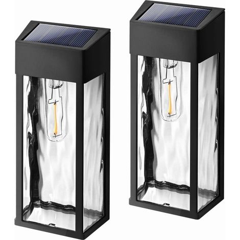 Paquete de dos apliques solares de exterior negros con bombillas LED, que se encienden automáticamente del anochecer al amanecer y son resistentes al agua. Ideales para patios y jardines. (1/5)