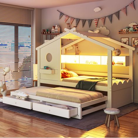 Cama infantil con forma de casita, de madera maciza blanca, de 90x200 cm, con cama nido (90x190 cm), iluminación LED y espacio de almacenamiento. (1/5)