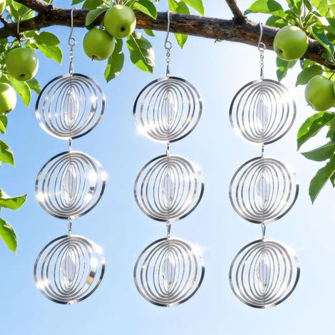 A set of three circular outdoor bird deterrents, made of reflective stainless steel, that can rotate to reflect light and deter birds. (1/4)