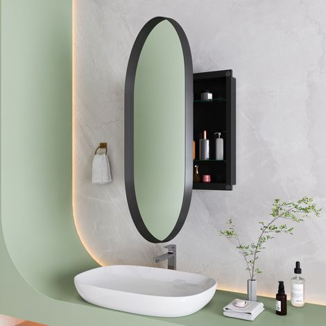 Armoire miroir ovale design noir, meuble de toilette mural encastré avec cadre métallique et étagères ajustables, rangement pratique pour salle de bain, salon ou chambre.