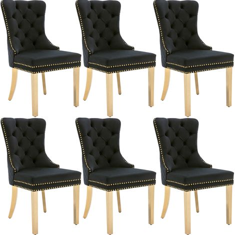 Silla de comedor de terciopelo negro con respaldo capitoné y patas doradas MODENUIT (1/5)
