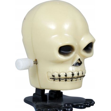 Decorazione di Halloween a forma di teschio finto che cammina e salta a carica manuale.
