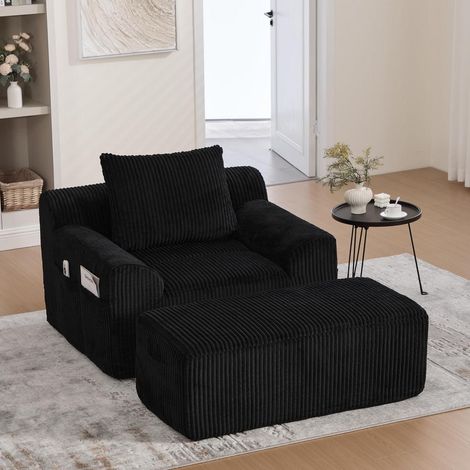 Übergroßer Cord Sessel mit Hocker, tiefem Sitz & Seitentaschen, Schwarz (1/5)