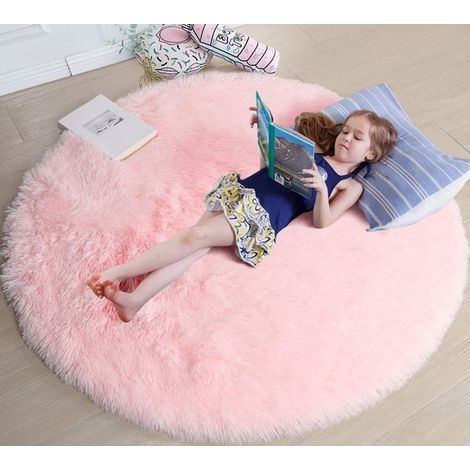 pink round rug, measuring 1.2 meters by 1.2 meters, is suitable for a girl's bedroom. A soft, round rug is ideal for a children's room. (1/5)