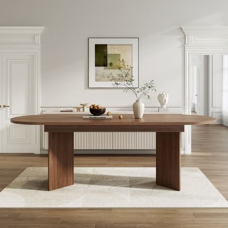 Une table à manger extensible (160/200 x 90 cm) pouvant accueillir de 6 à 8 personnes elle présente des coins arrondis, un plateau épais et un style minimaliste finition noyer. (1/5)