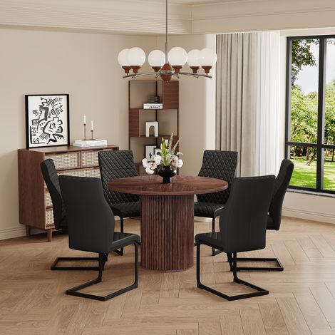 Ensemble table et chaises: table à manger ronde en MDF aspect noyer de 100 cm avec pieds cylindriques et design à fixation auto-agrippante, accompagnée de 6 chaises de salle à manger noires à motif lo