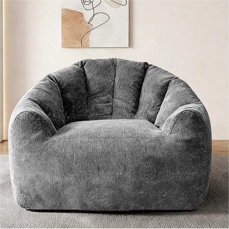 Pouf ergonomique rond épousant les contours du corps pour une détente et un confort optimaux à domicile. (1/5)