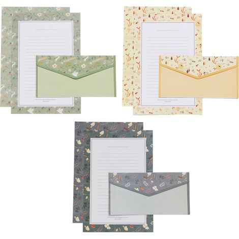 Ensemble de papeterie comprenant du papier à lettres, des enveloppes et du papier à lettres.