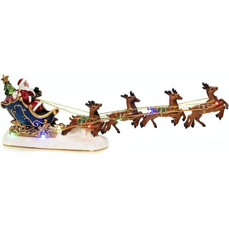 Adorno navideño luminoso que representa a Papá Noel en su trineo tirado por renos, funciona con 3 pilas AAA (no incluidas) y cuenta con luces LED multicolores (36 x 7 x 12 cm). (1/3)