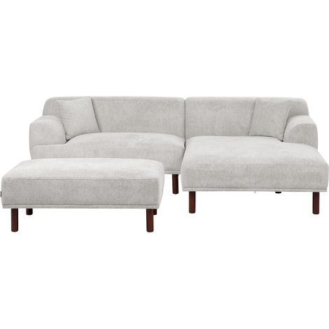 Divano ad angolo sinistro in tessuto grigio chiaro lato sinistro con pouf e gambe in legno Holt