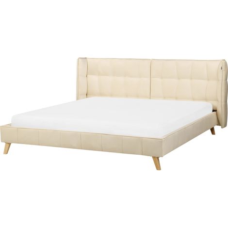 Cama tapizada en terciopelo beige con patas de madera clara 180 x 200 cm somier con listones cabecero con alas ajustables Senlis