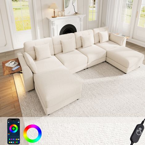 Divano angolare U/L a 6 posti 292x135 cm con illuminazione a LED, divano modulare con 2 pouf mobili e tavolini pieghevoli nei braccioli, ciniglia beige (1/5)