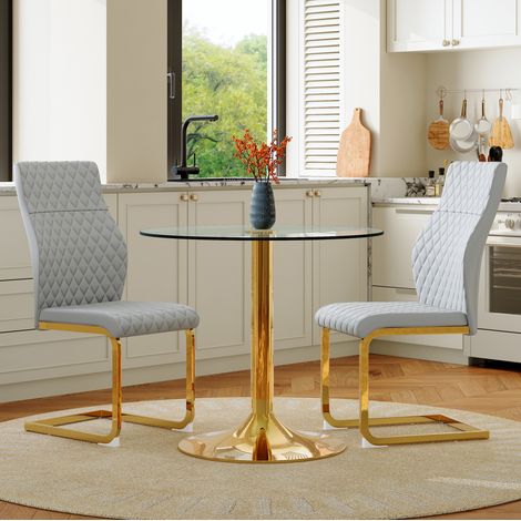 Set da pranzo con tavolo rotondo in vetro 85 cm e 2 sedie grigio chiaro e dorato (1/5)