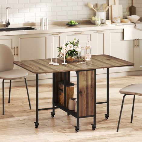 Table à manger pliante sur roulettes, table de cuisine pour 6 personnes avec étagère intégrée, 130 x 80 x 74 cm, marron (1/5)