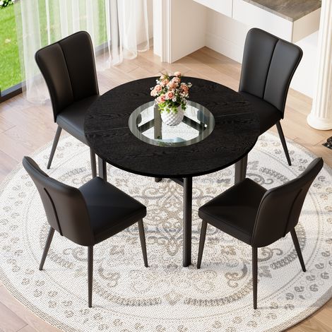 Set tavolo rotondo moderno minimalista 100 cm nero con 4 sedie in PU e gambe in metallo (1/5)
