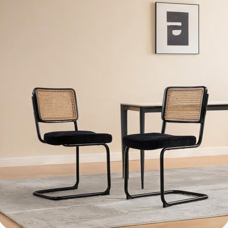 Chaise de salle à manger vintage en métal noir et rotin (1/5)