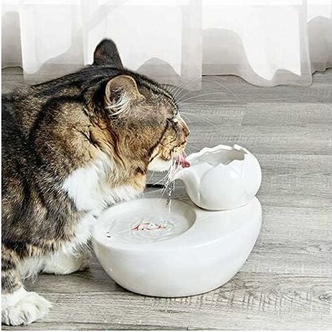 Fuente de agua de cerámica para gatos de 1,3 litros con filtro antibacteriano, funcionamiento silencioso por debajo de 45 decibelios y diseño vertical en forma de loto. (1/5)