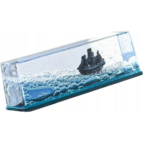 Adorno decorativo de acr铆lico con forma de barco pirata y perla a la deriva. (1/5)
