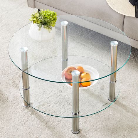 Table basse design moderne verre trempé, deux plateaux argentés, structure métallique stable et spacieuse, style luxe subtil, reflets vitrés élégants.