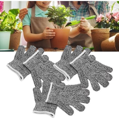 Paar schnittfeste Kinderhandschuhe. Sicherheitshandschuhe für Kinder bei Gartenarbeiten.