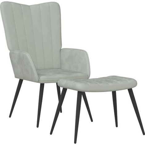 Un fauteuil lounge avec repose-pieds, recouvert de velours gris clair. (1/5)