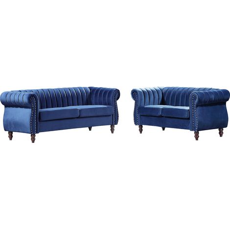 Vente-Unique – Canapé Chesterfield 3 places et 2 places en velours bleu roi – Structure en bois – Garnissage mousse polyuréthane – Confort équilibré