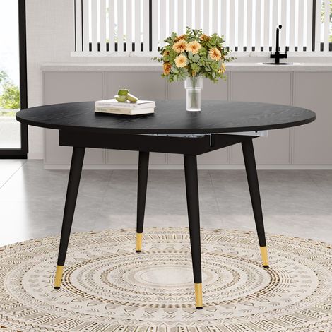Table de salle à manger extensible moderne, transformable de ronde en ovale, plateau en MDF noir/noyer avec détails dorés, pieds en métal robustes, gain de place pour la cuisine et la salle à manger (1/4)