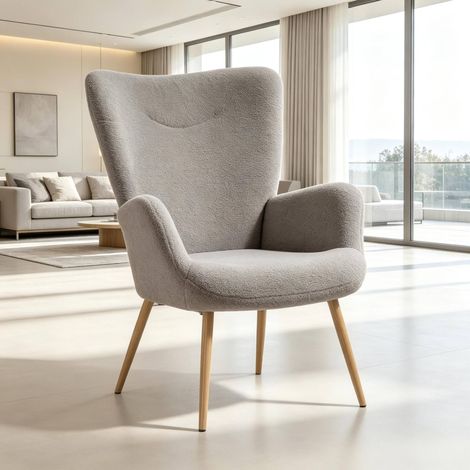 Sillón lounge gris con respaldo alto, reposabrazos integrados y estructura de acero DESVIAE (1/5)