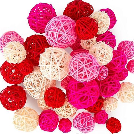 42 boules en rotin rose, idéales pour remplir bols et vases, pour décorer une table lors d'un mariage ou d'un anniversaire. (1/5)