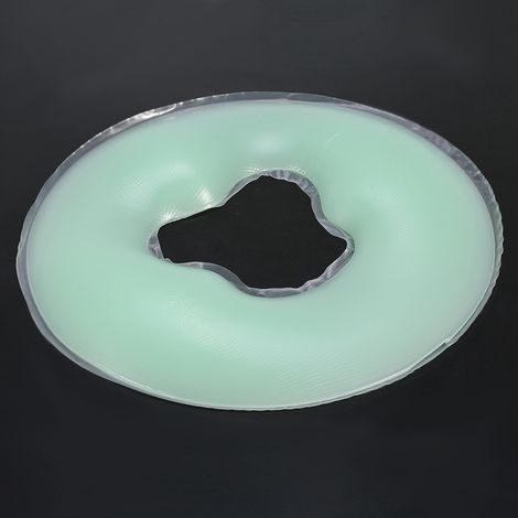 Coussin de massage en silicone souple vert clair pour le visage et le visage.