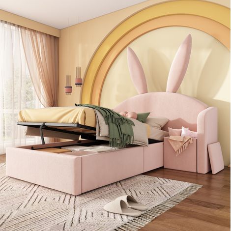 Lit enfant rembourré en velours rose 90x200 cm avec tête de lit oreilles de lapin, coffre relevable et chevet (1/5)