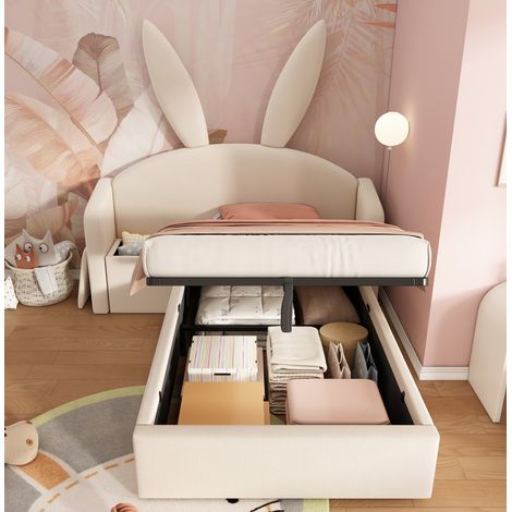 Letto imbottito per bambini stile coniglietto in velluto beige 90x200 cm con testiera avvolgente, vano contenitore idraulico e comodino (1/5)