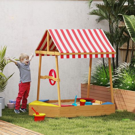 Sandkasten aus Holz in Form eines Bootes mit verstellbarem Verdeck, Ruder und Bodenwanne für naturnahes Spielen im Freien (1/5)