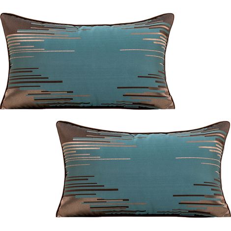 Deux taies d'oreiller rectangulaires pour un style raffiné dans le salon. (1/4)