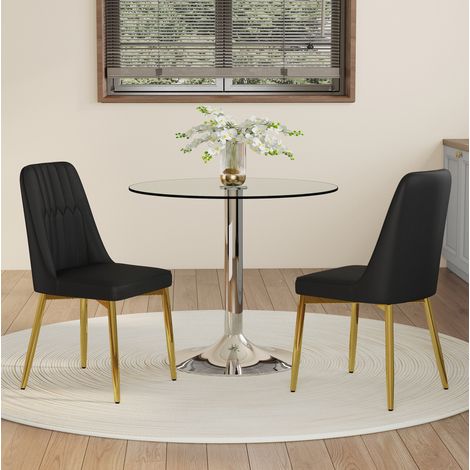 Set da pranzo con tavolo rotondo in vetro e metallo argento 85x76 cm e 2 sedie in PU nero con gambe oro (1/5)