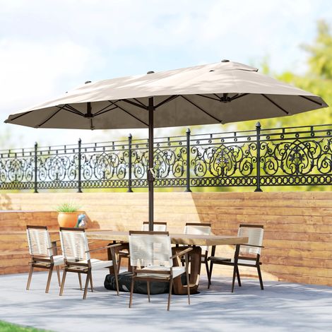 Parasol de jardin double à 12 baleines, avec pied en croix et ouverture à manivelle. Parasol de terrasse avec sacs de lestage. En acier et polyester. 455 x 265 x 238 cm. Kaki.