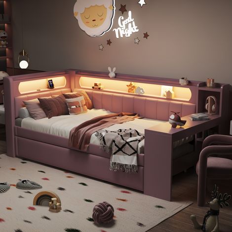 Lit de jour en tissu, dimensions 90x200 cm. Le lit est équipé de prises USB et d’un cadre LED. Il comprend également un lit extérieur et un bureau. Couleur rose. (1/4)