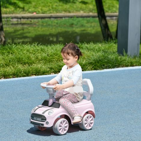Voiture électrique pour enfants de 18 à 36 mois avec volant, klaxon et système anti-basculement. Charge maximale : 25 kg. Dimensions : 53 x 25 x 35 cm. Rose. (1/5)