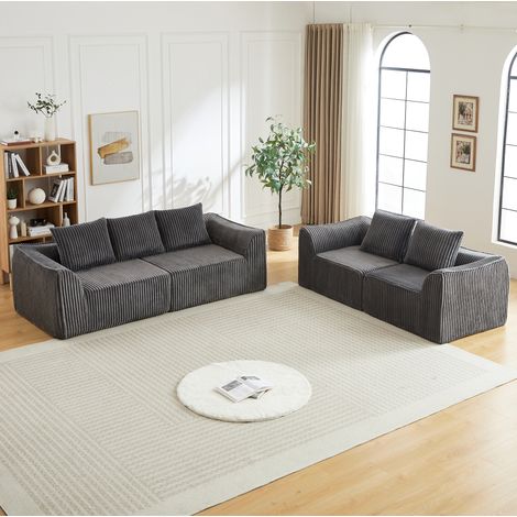 Sofá modular de pana gris, líneas redondeadas, respaldo inclinado y 5 cojines, REDOM (1/5)